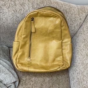c&c leather mustard colored backpack.